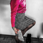 Man wearing a skirt with a blouse