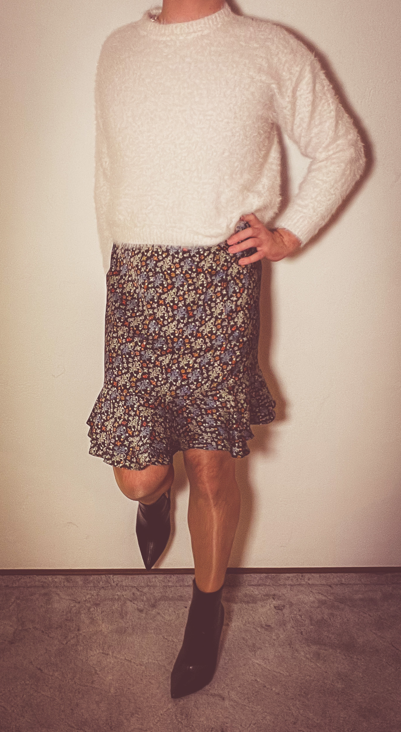 Flared wrap skirt with a spring pattern, worn with a white blouse