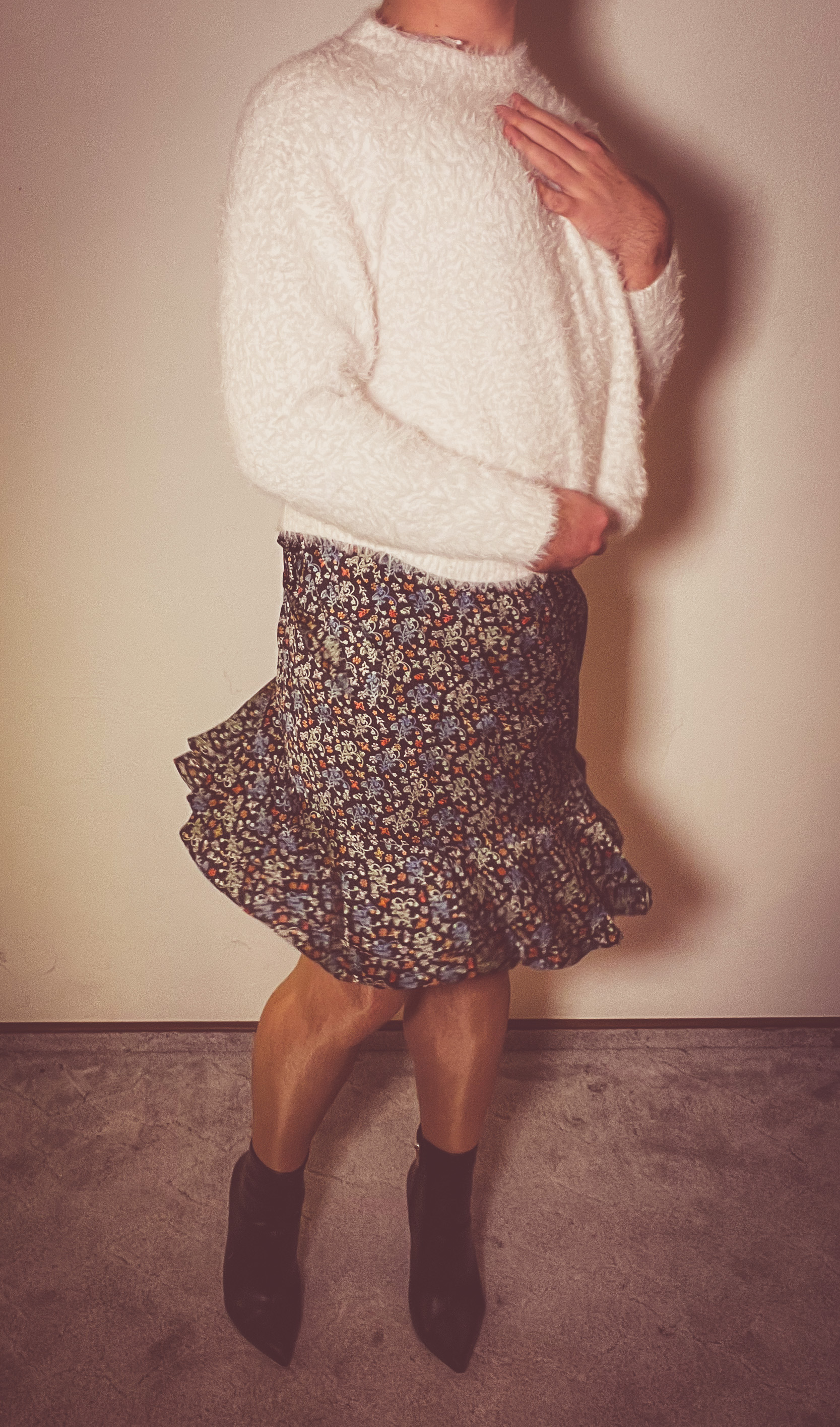 Man wearing a flared wrap skirt with a spring floral pattern