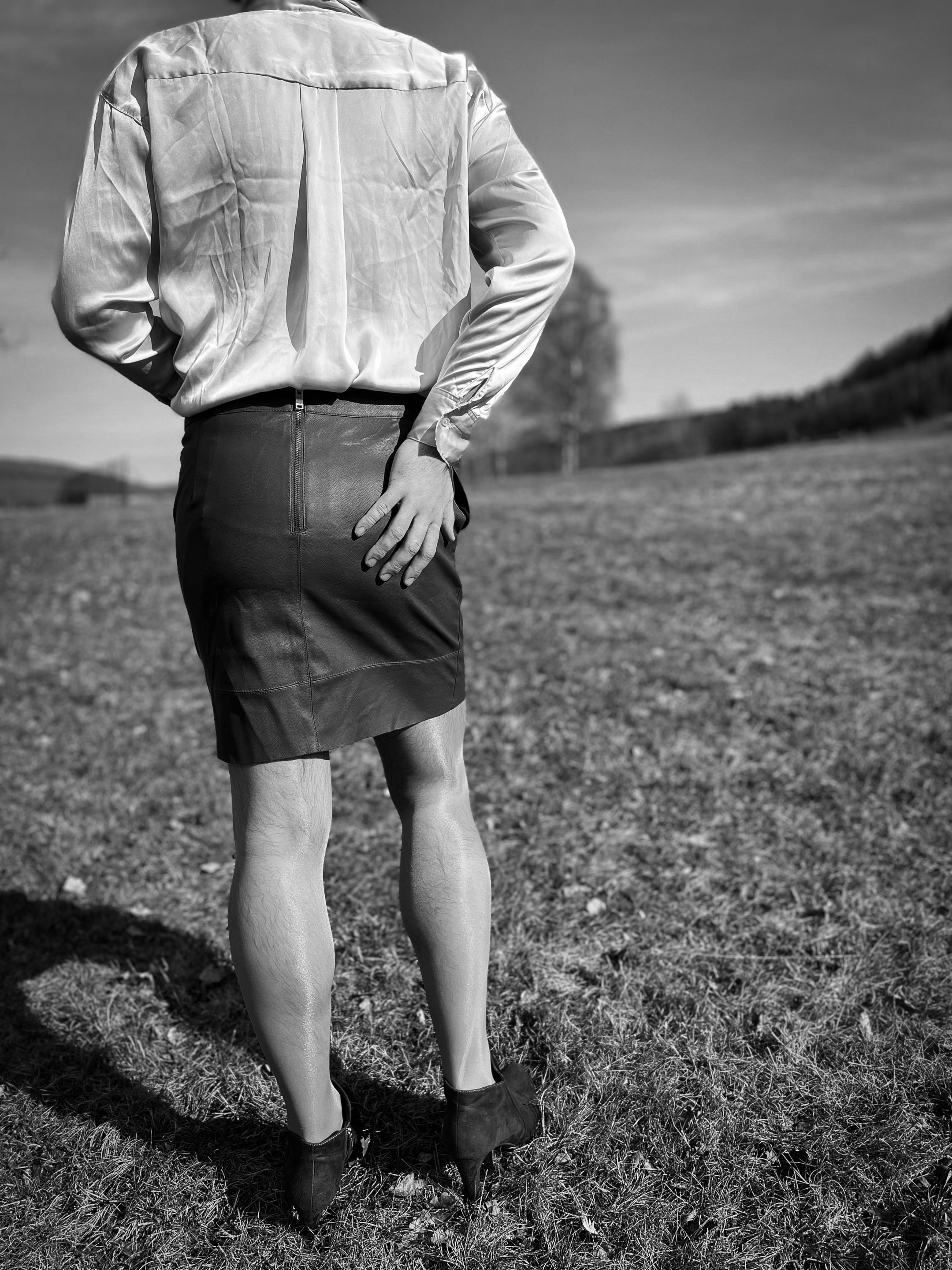 Man in a leather skirt, viewed from behind