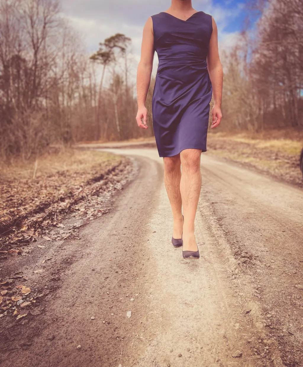 Man wearing high heels and a dress