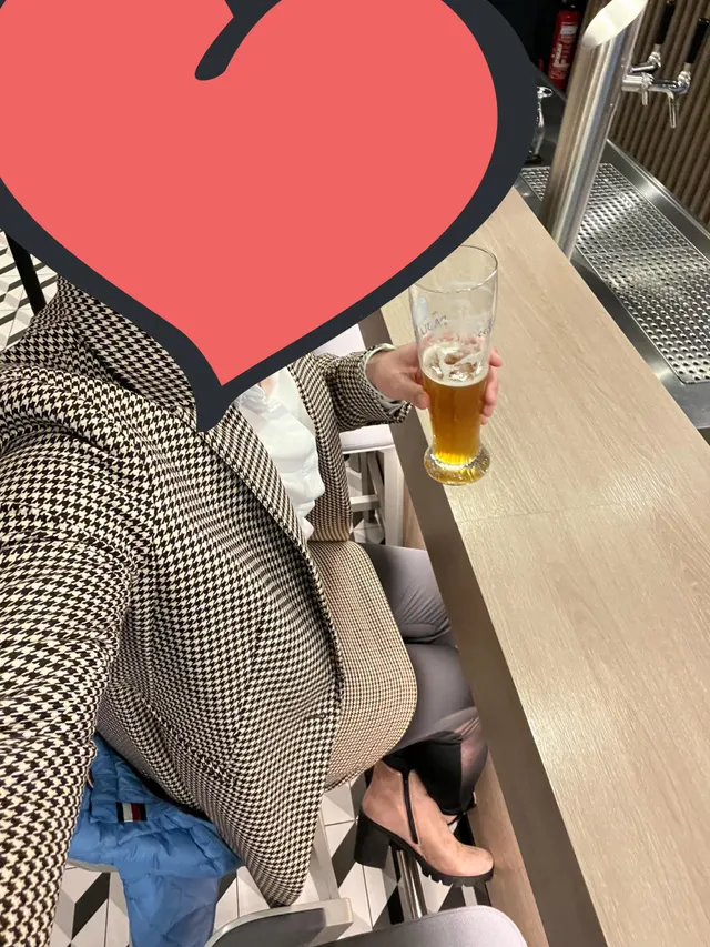 Man dressed for a business trip in a skirt and heeled boots